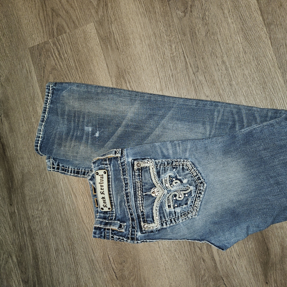Rock Revival Faded Blue Jeans with Embroidered Pockets